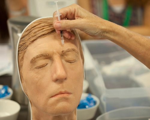 Practicing injecting on a mannequin